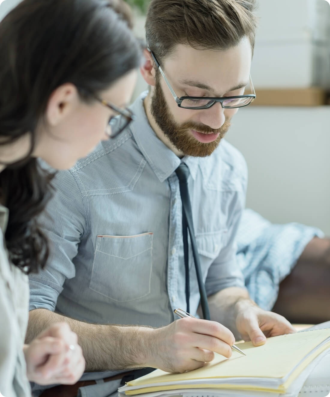 A real estate agent going through paperwork with a client