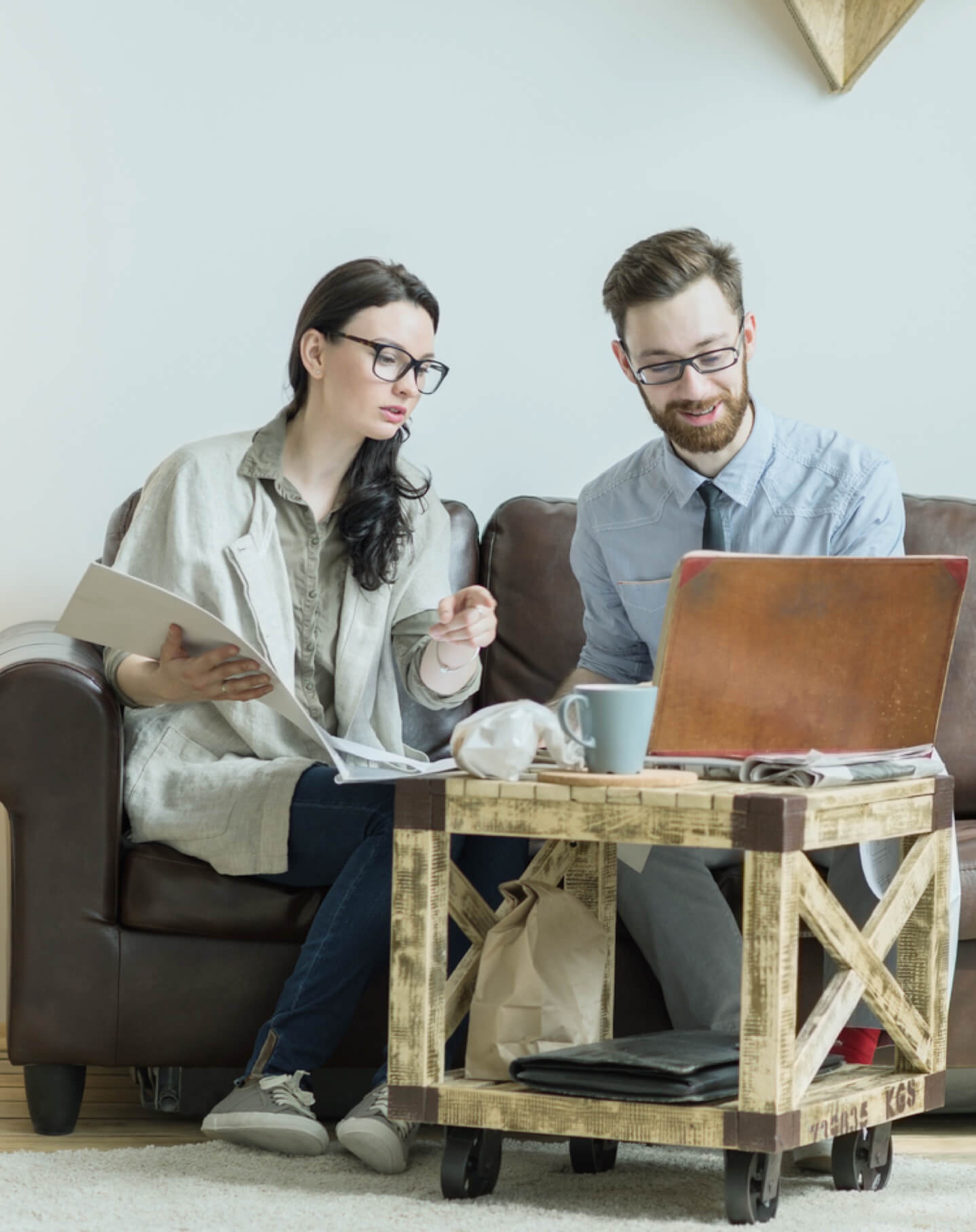 Two realtors working on their real estate website design