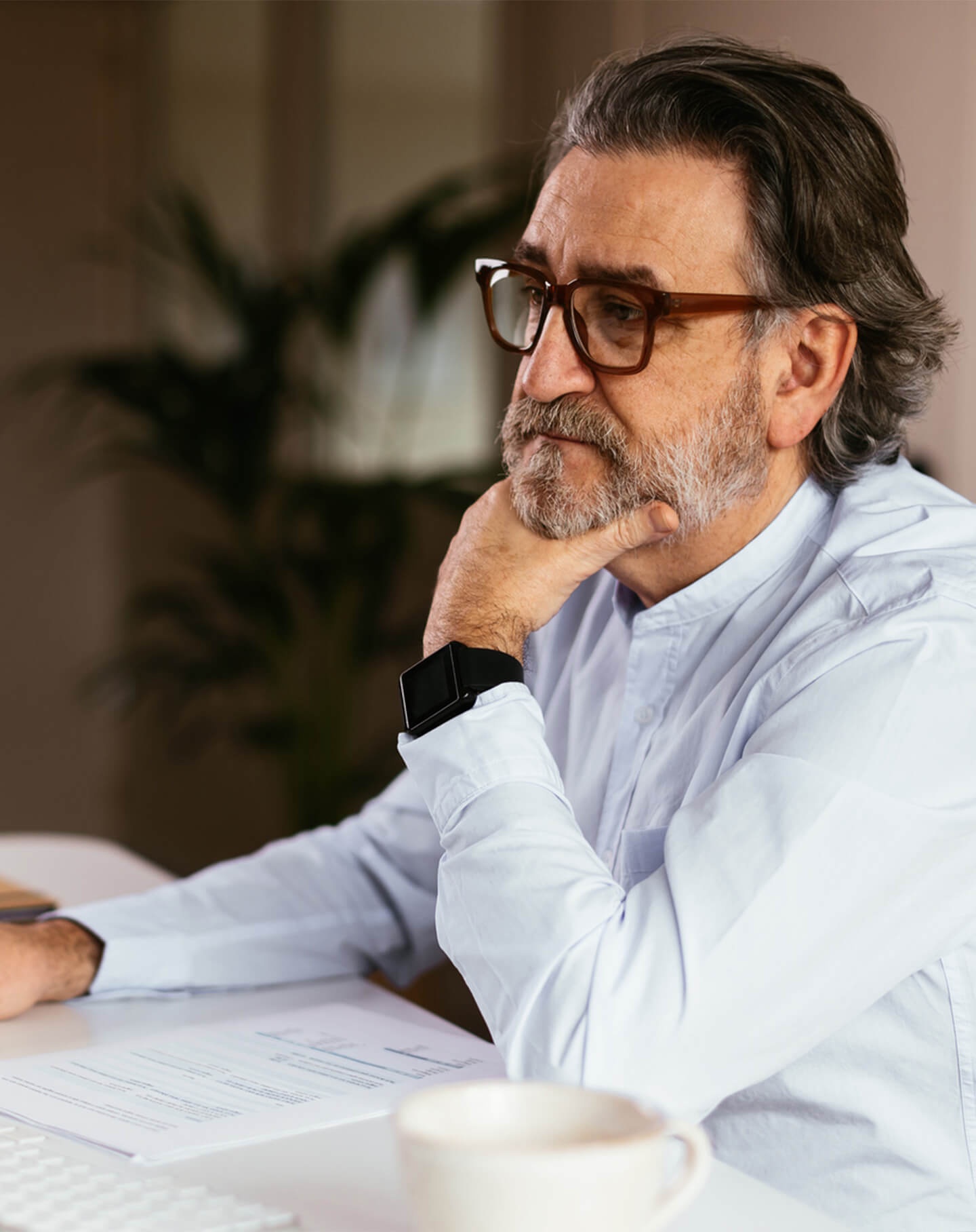 A man reviews a piece of paper with a plan for his author website